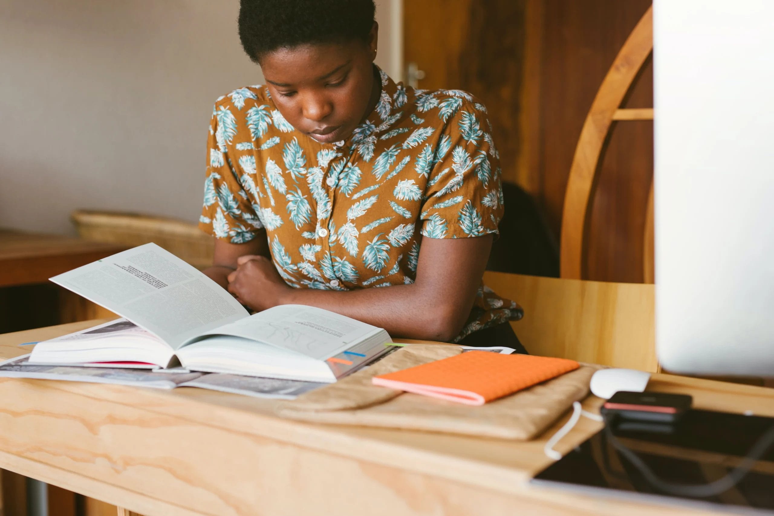 woman studying a book
